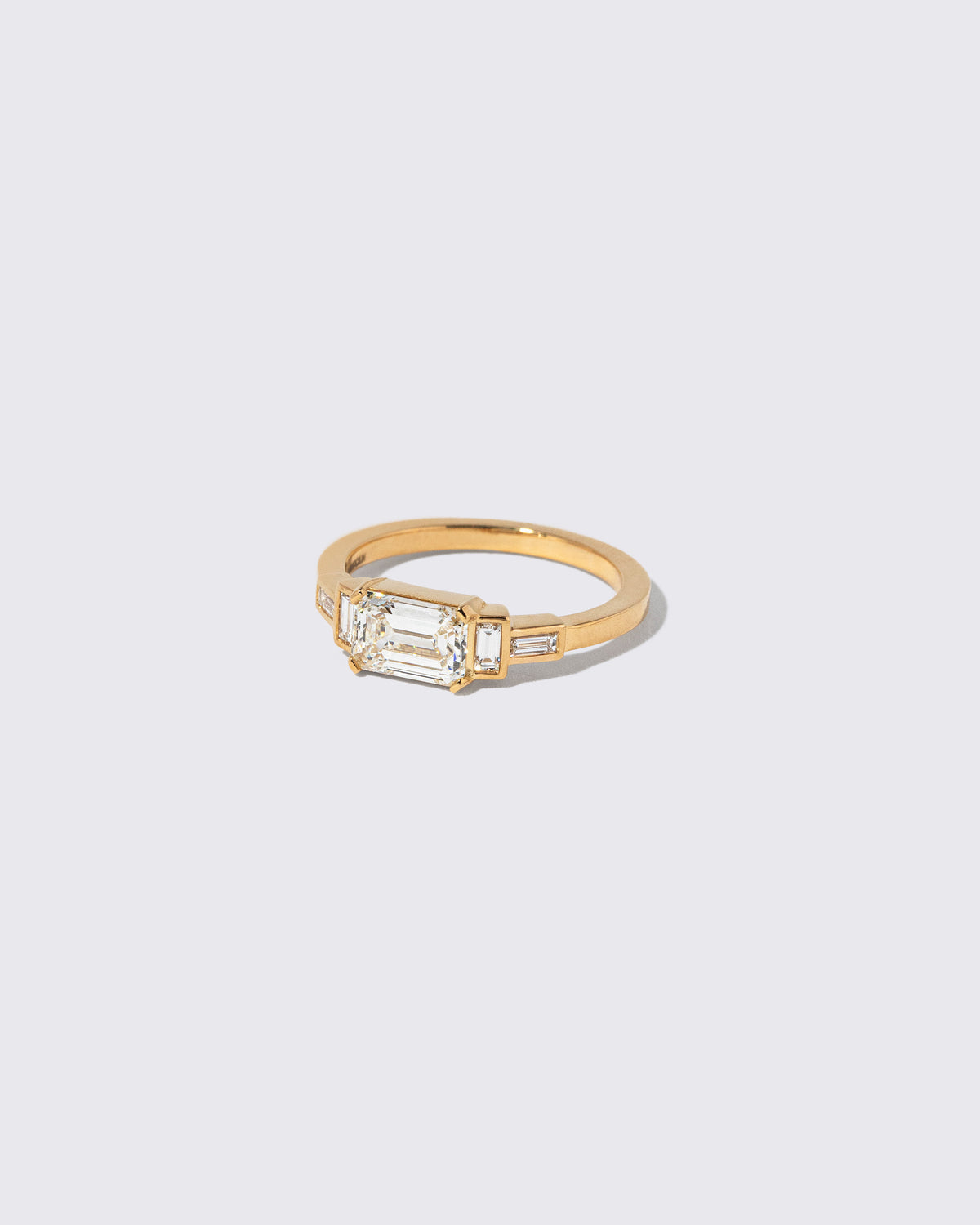 View from the side of the Diamond Expression Ring on light color background.