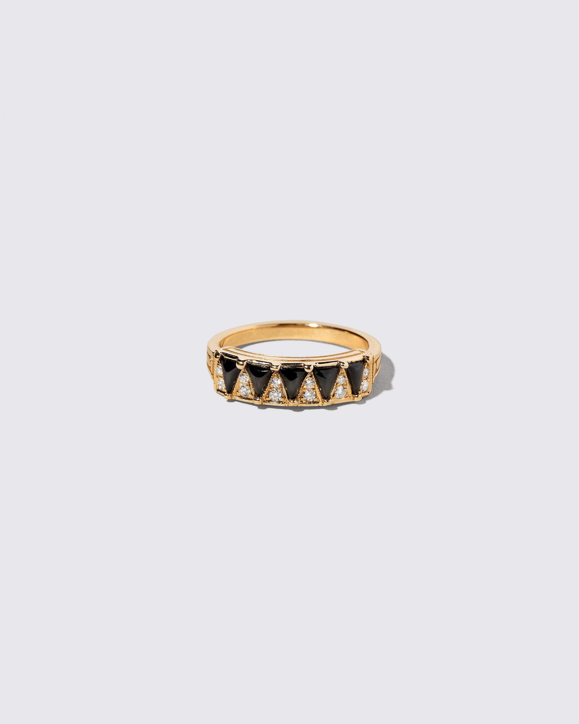 Gold Black Spinel Five Triangle Ring on light color background.
