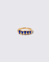 Gold Lapis Five Triangle Ring on light color background.