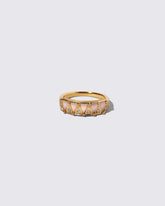 Gold Pink Opal Five Triangle Ring on light color background.