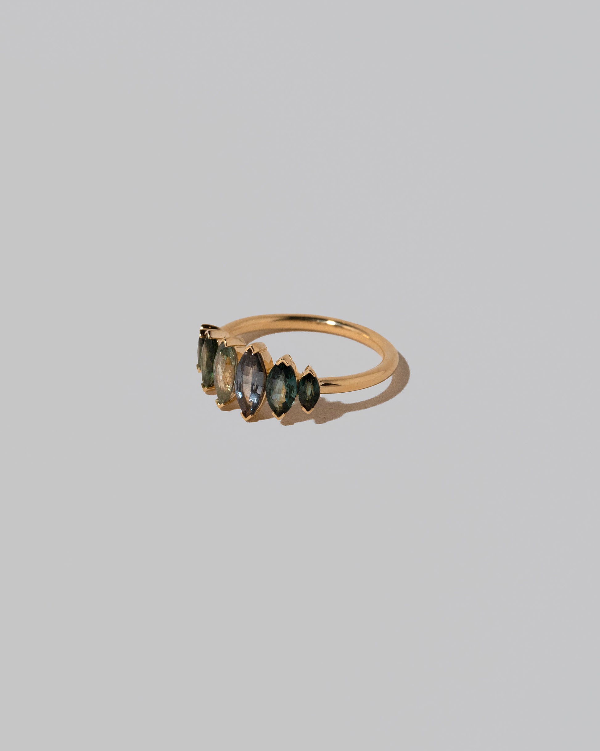 View from the side of the Fritillaria Ring on light color background.