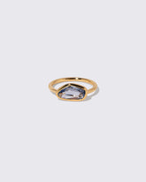 Blue Sapphire Gusher Ring on light color background.