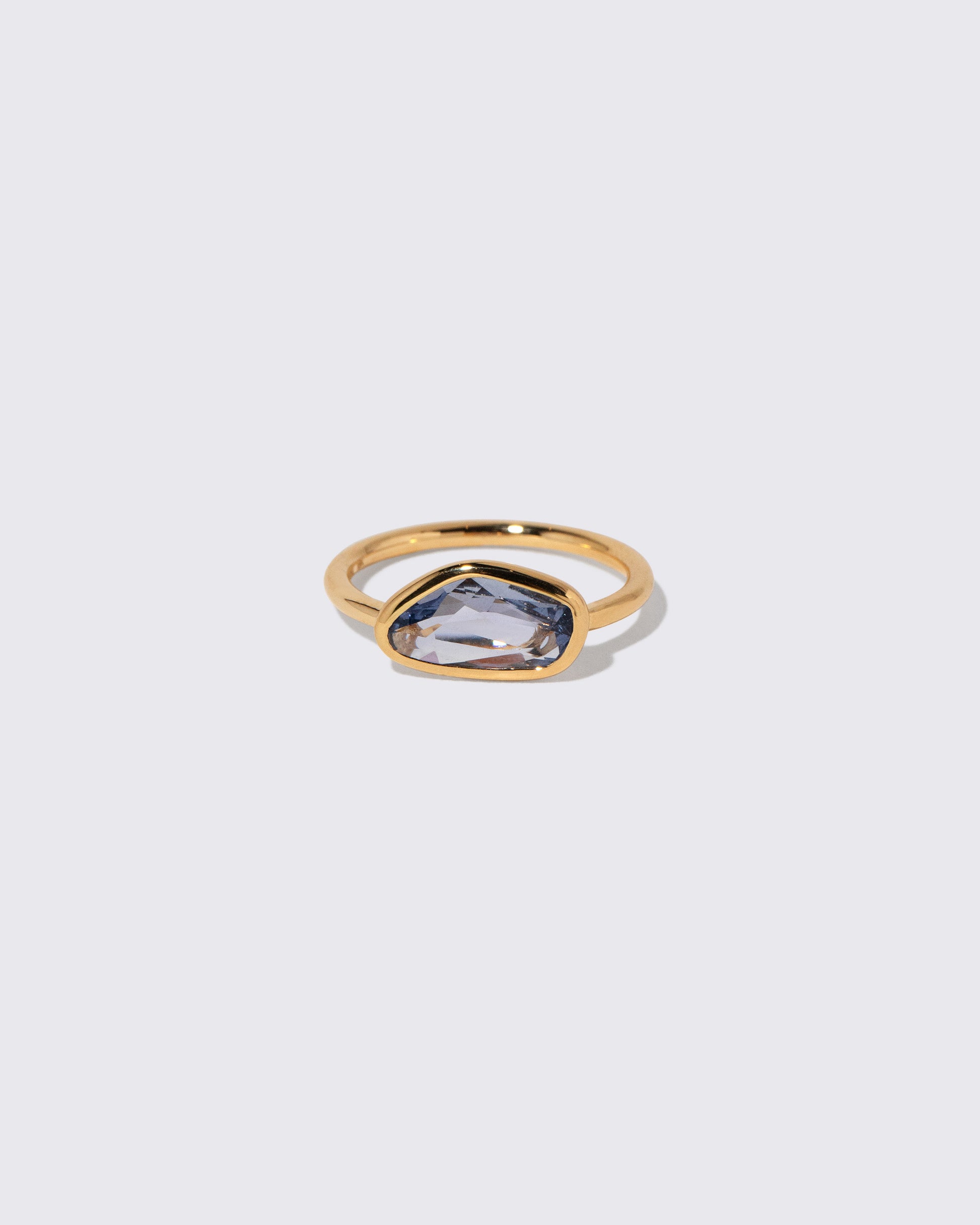 Blue Sapphire Gusher Ring on light color background.