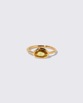 Yellow Sapphire Gusher Ring on light color background.