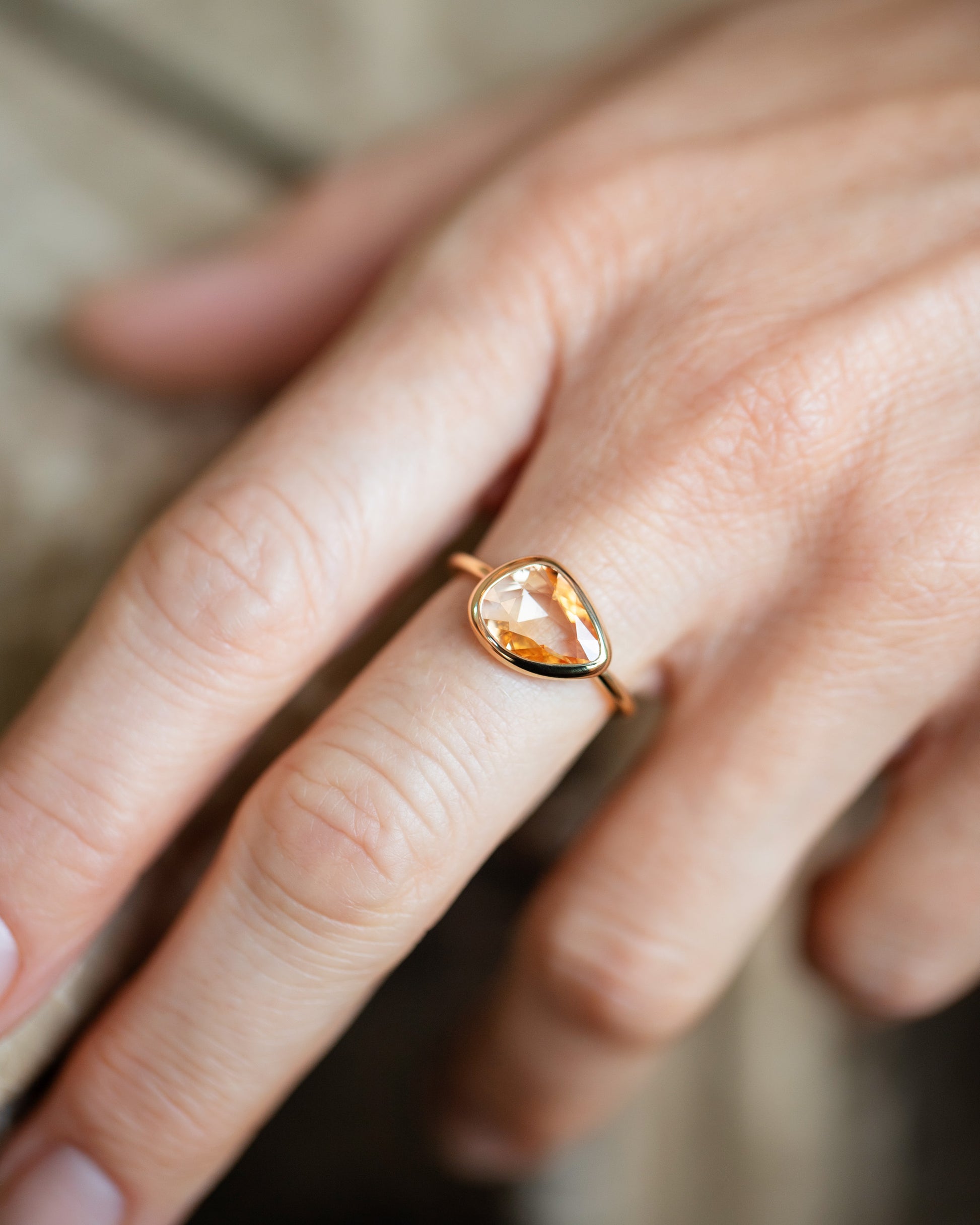 Peach Pink Sapphire Gusher Ring on model.