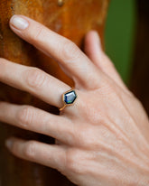 Teal Blue Sapphire Gusher Ring on model.