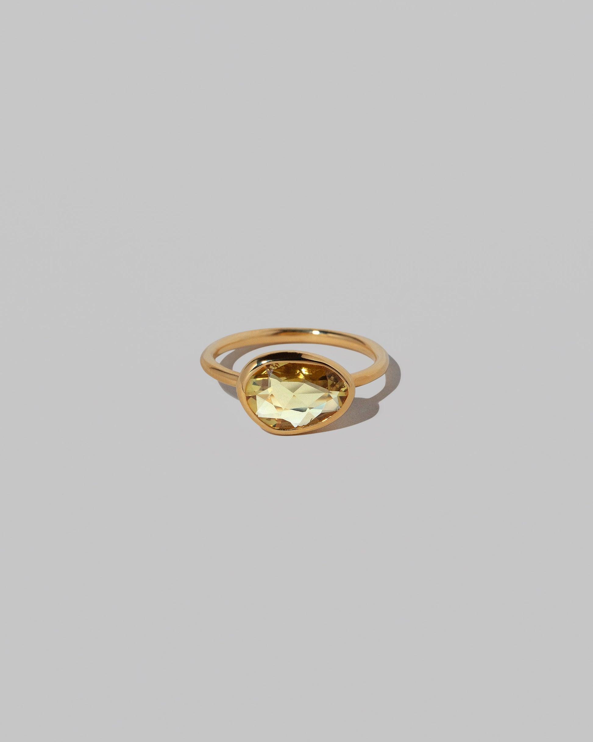 Gusher Yellow Sapphire Ring 033 on light color background.