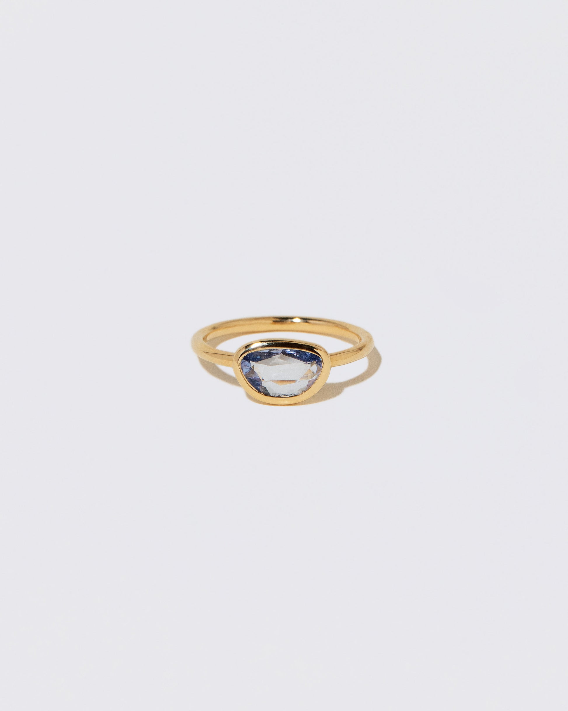 Gusher Blue Sapphire Ring 055 on light color background.