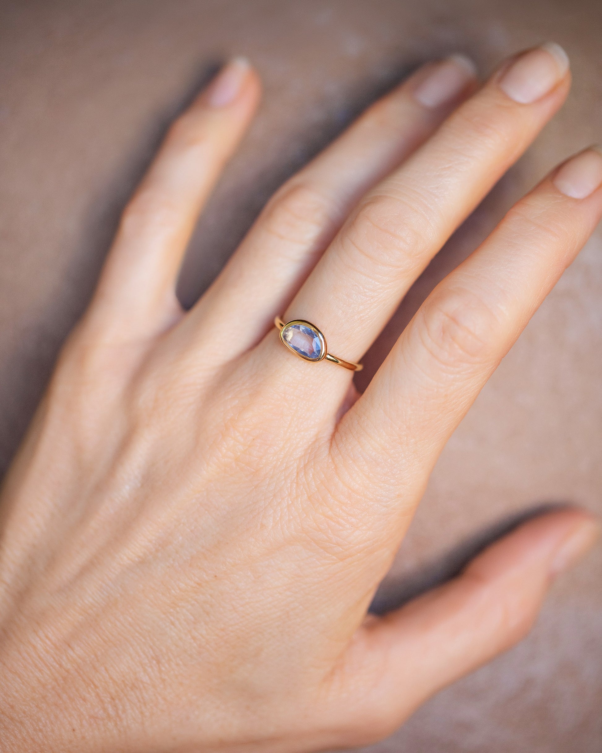 Gusher Blue Sapphire Ring 055 on model.