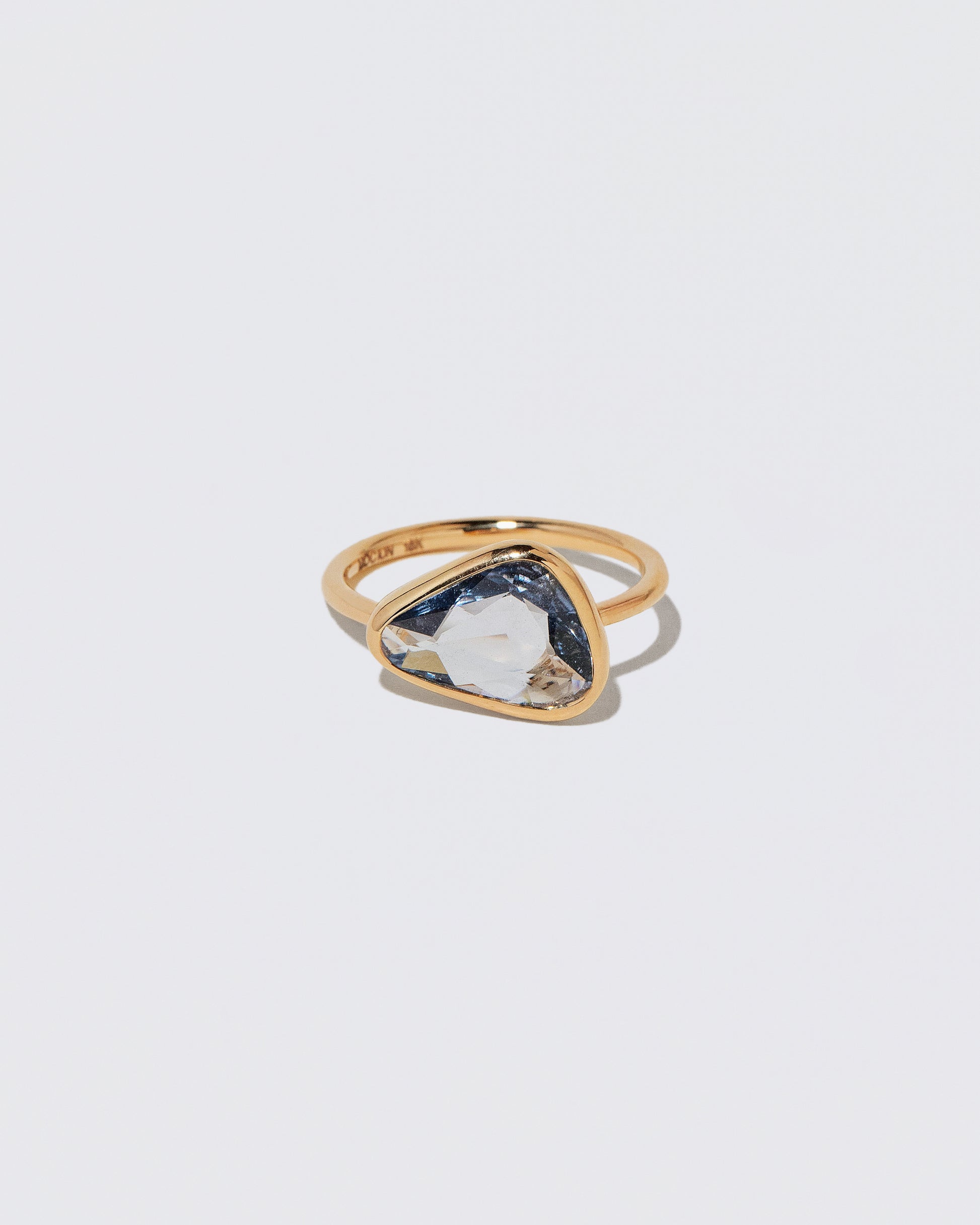 Gusher Blue Sapphire Ring 056 on light color background.