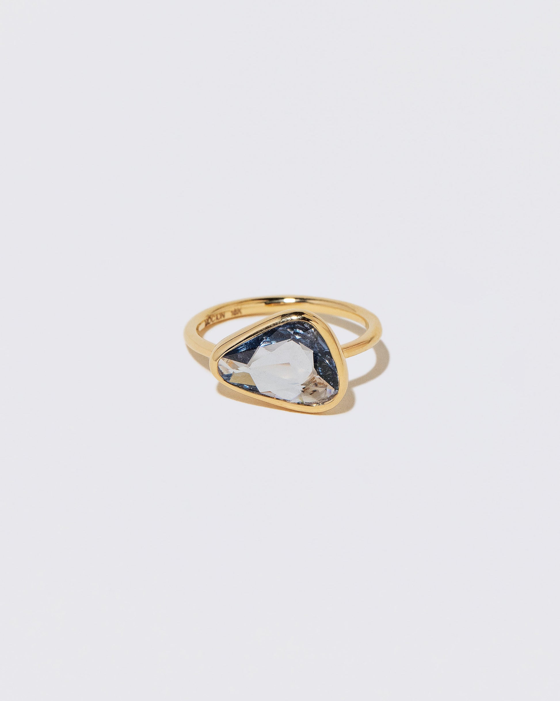 Gusher Blue Sapphire Ring 056 on light color background.