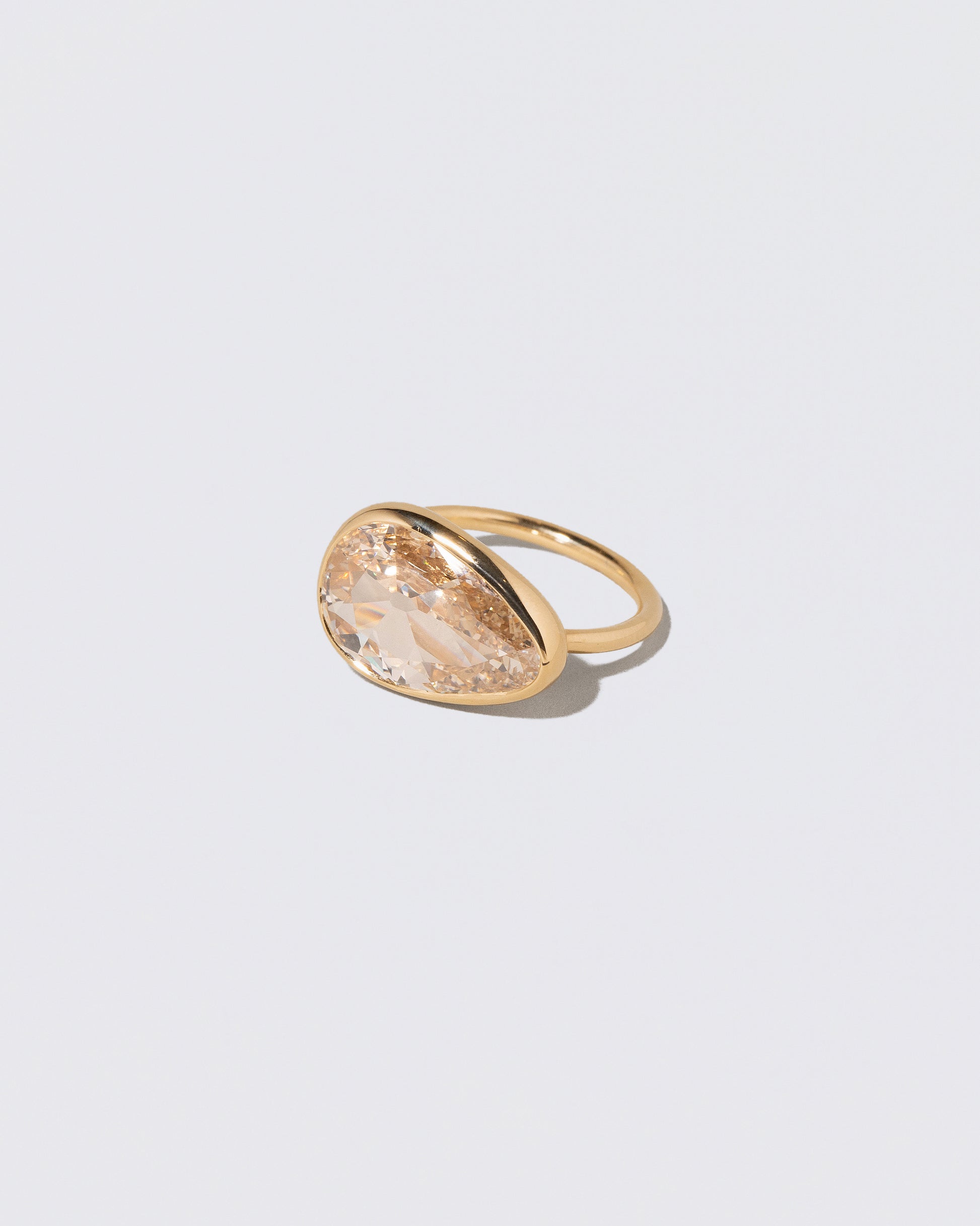 View from the side of the Gusher Diamond Ring 009 on light color background.