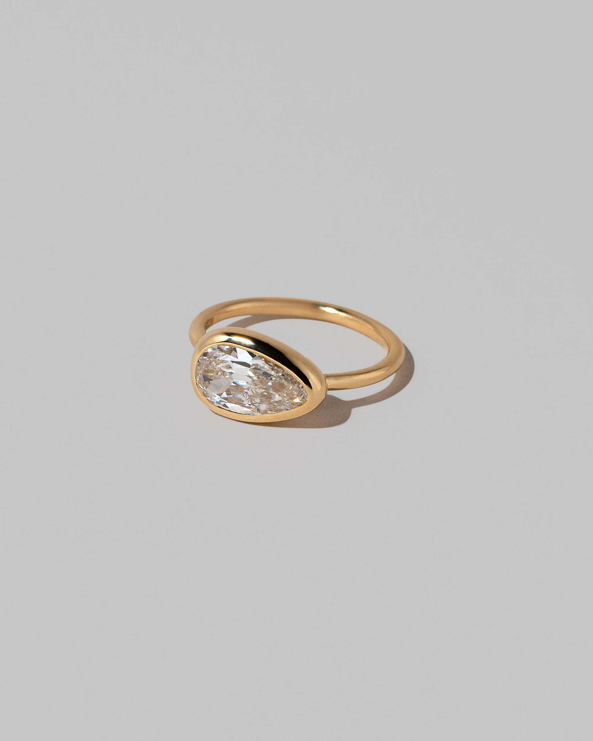 View from the side of the Gusher Diamond Ring 041 on light color background.