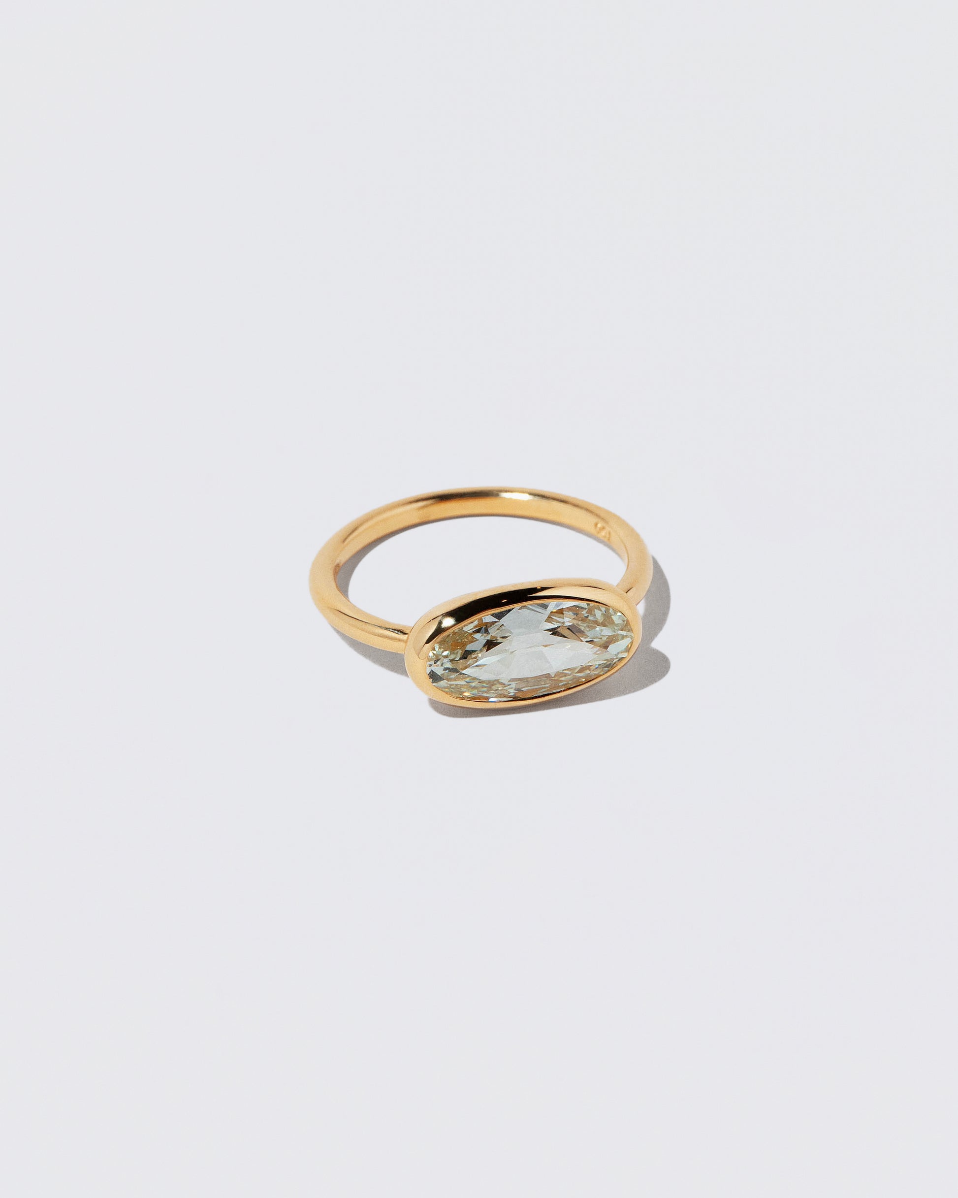 View from the side of the Gusher Diamond Ring 045 on light color background.