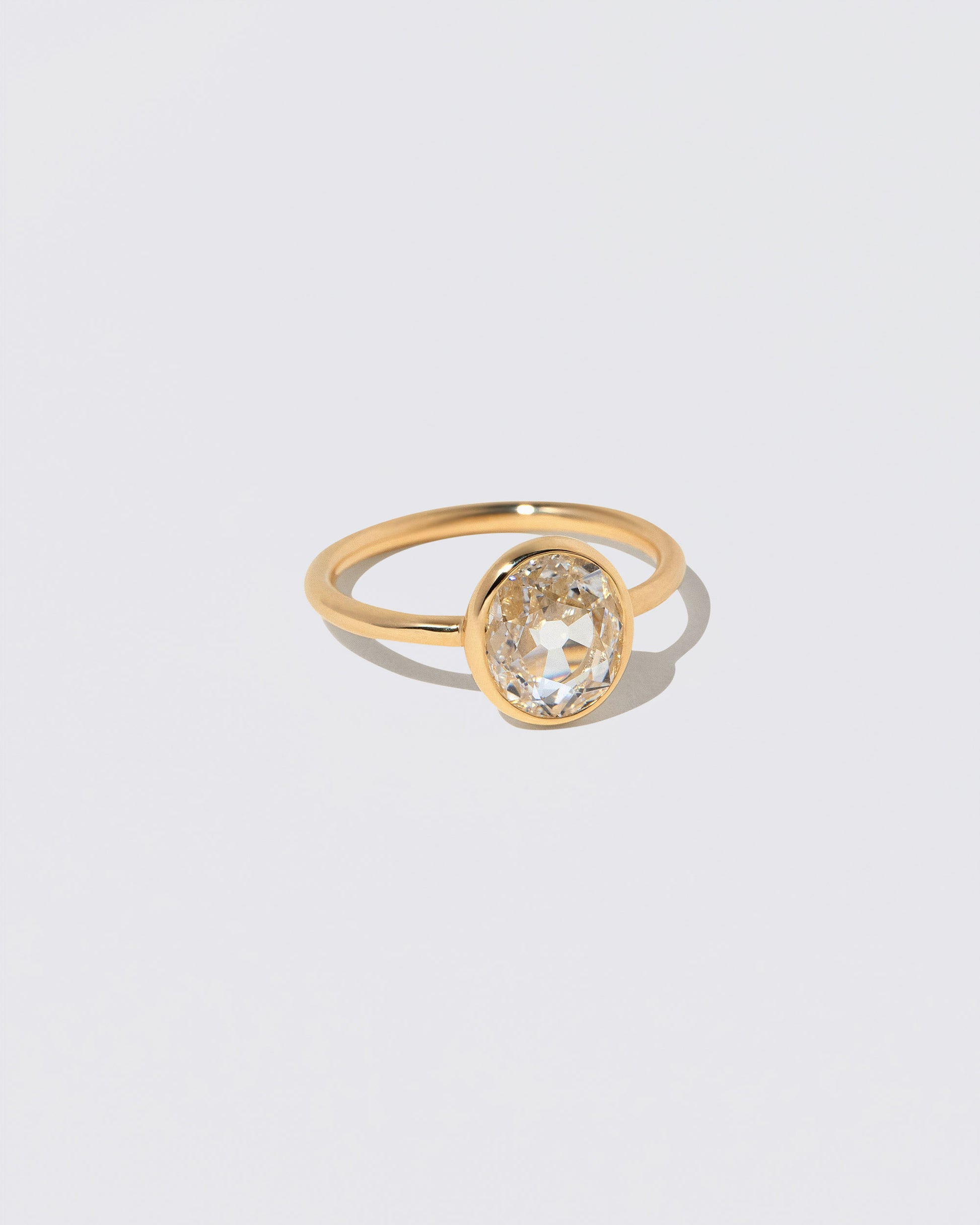 View from the side of the Gusher Diamond Ring 048 on light color background.