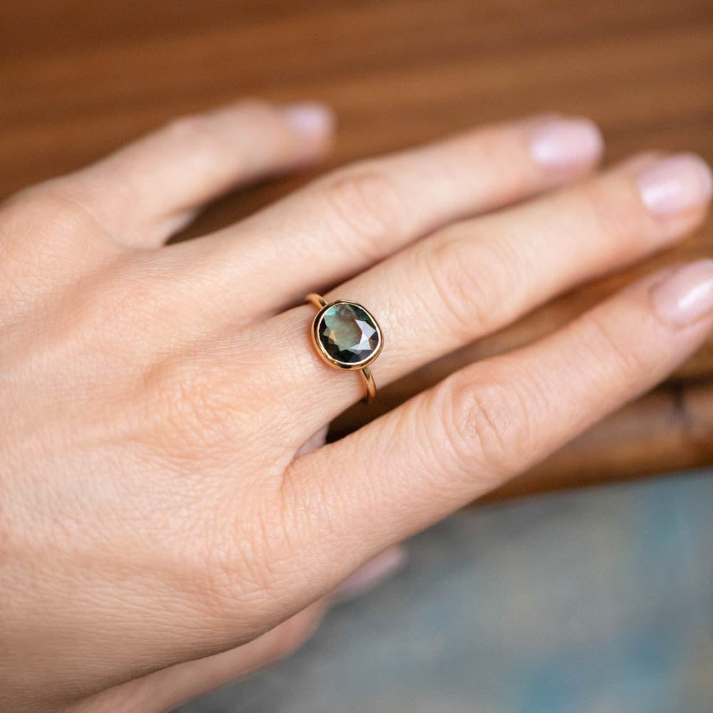 product_details::Gusher Green Sapphire Ring 032 on model.