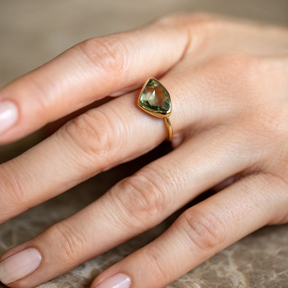 product_details::Gusher Green Sapphire Ring 036 on model.