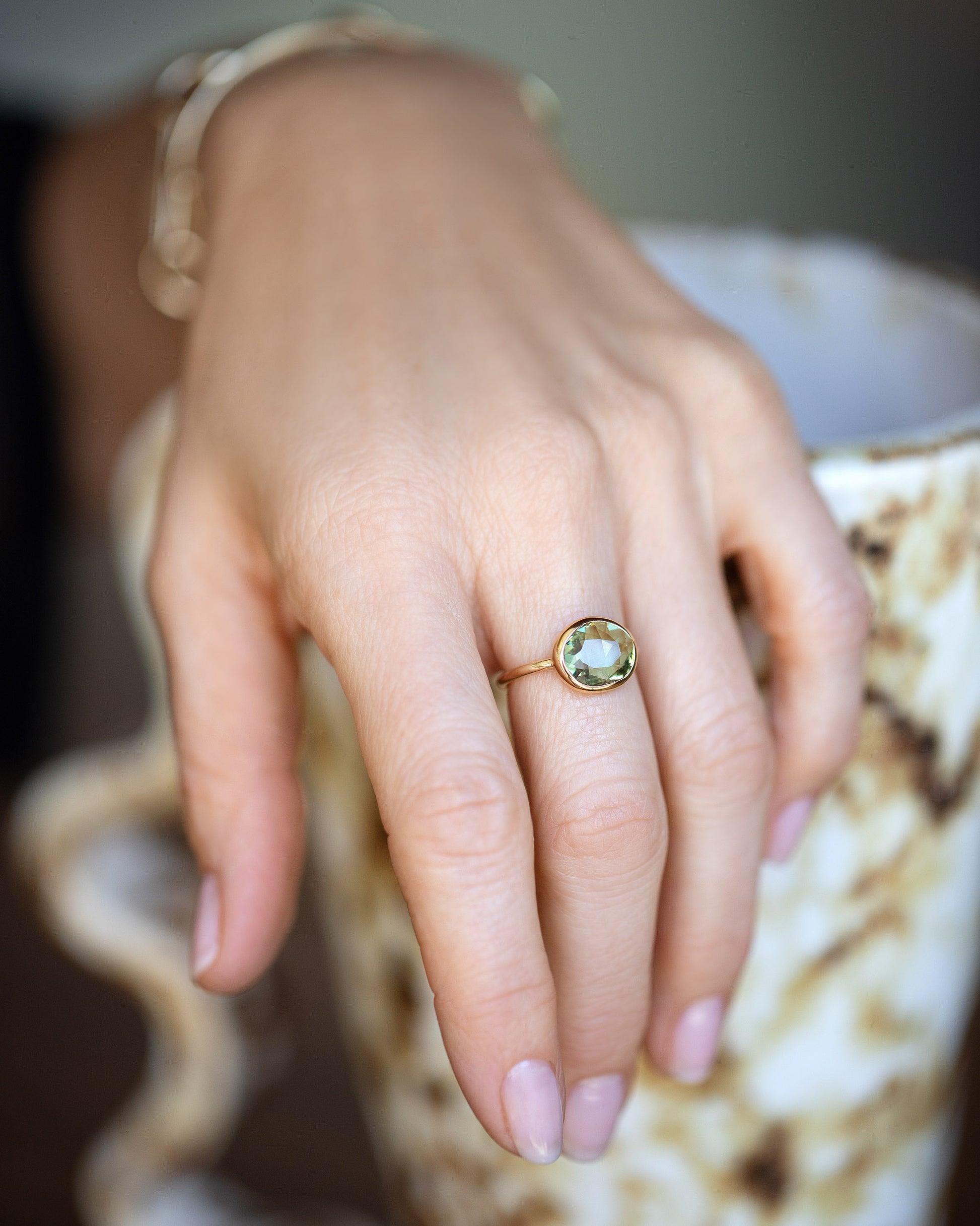 Gusher Green Sapphire Ring 052 on model.