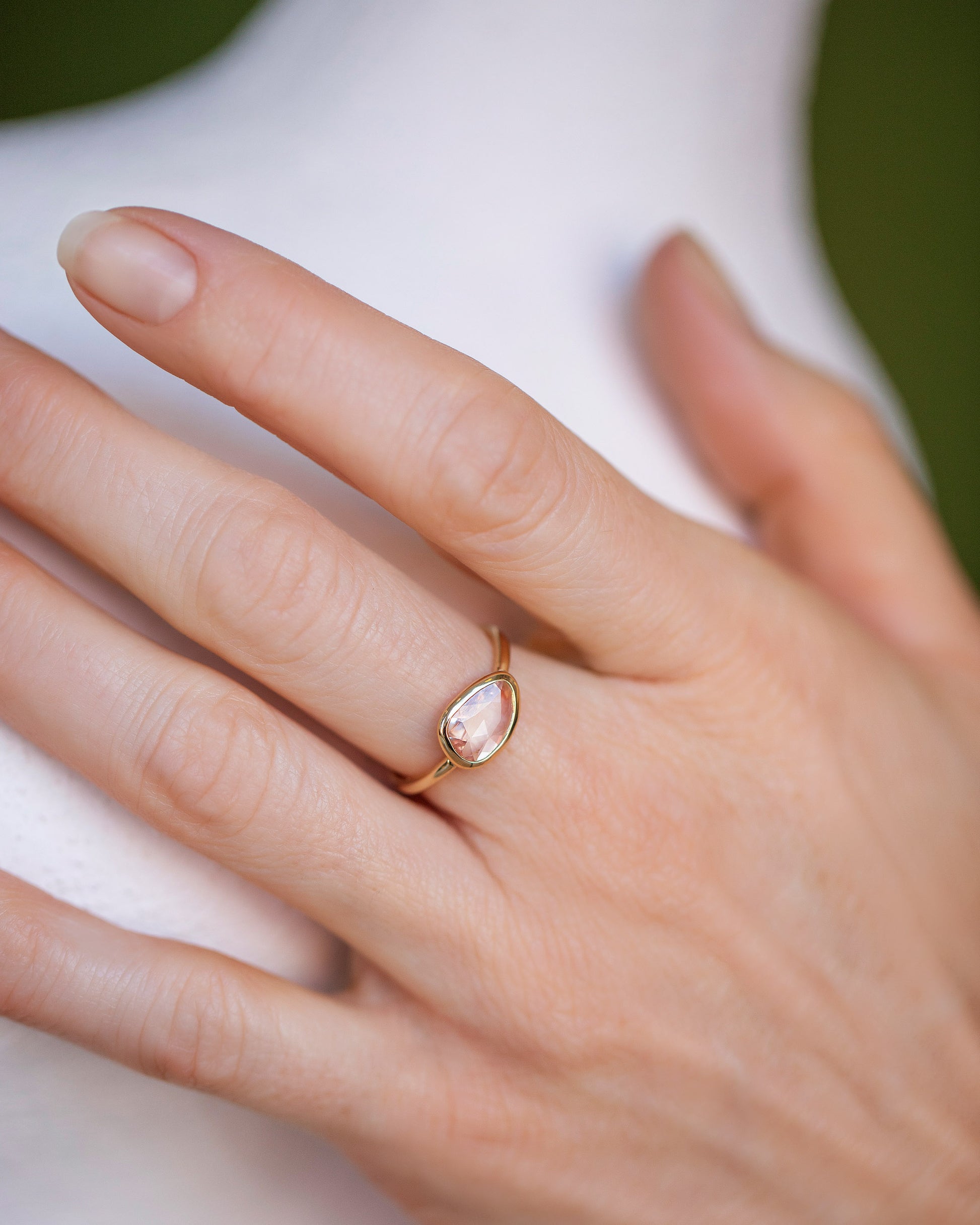 Gusher Peach Sapphire Ring 051 on model.