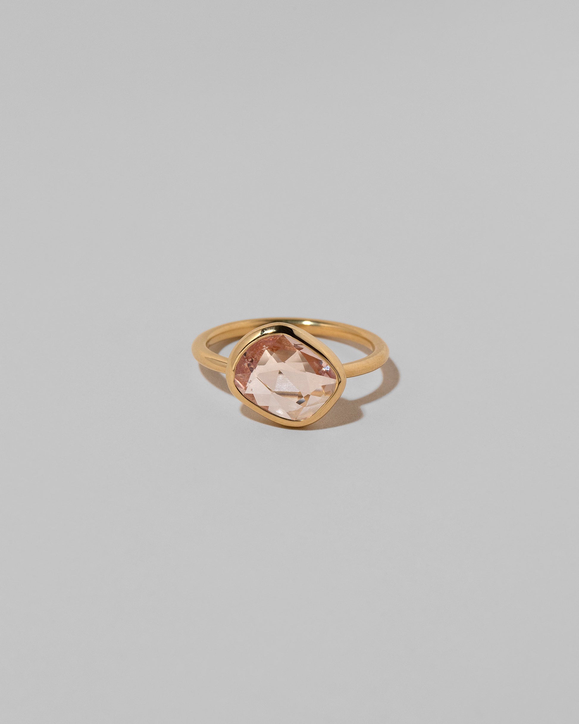 Gusher Pink Sapphire Ring 040 on light color background.