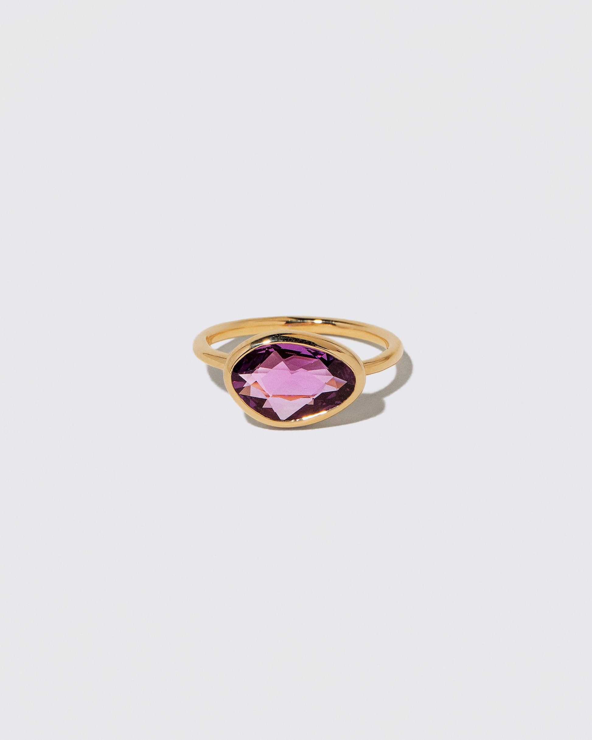 Gusher Pink Sapphire Ring 053 on light color background.