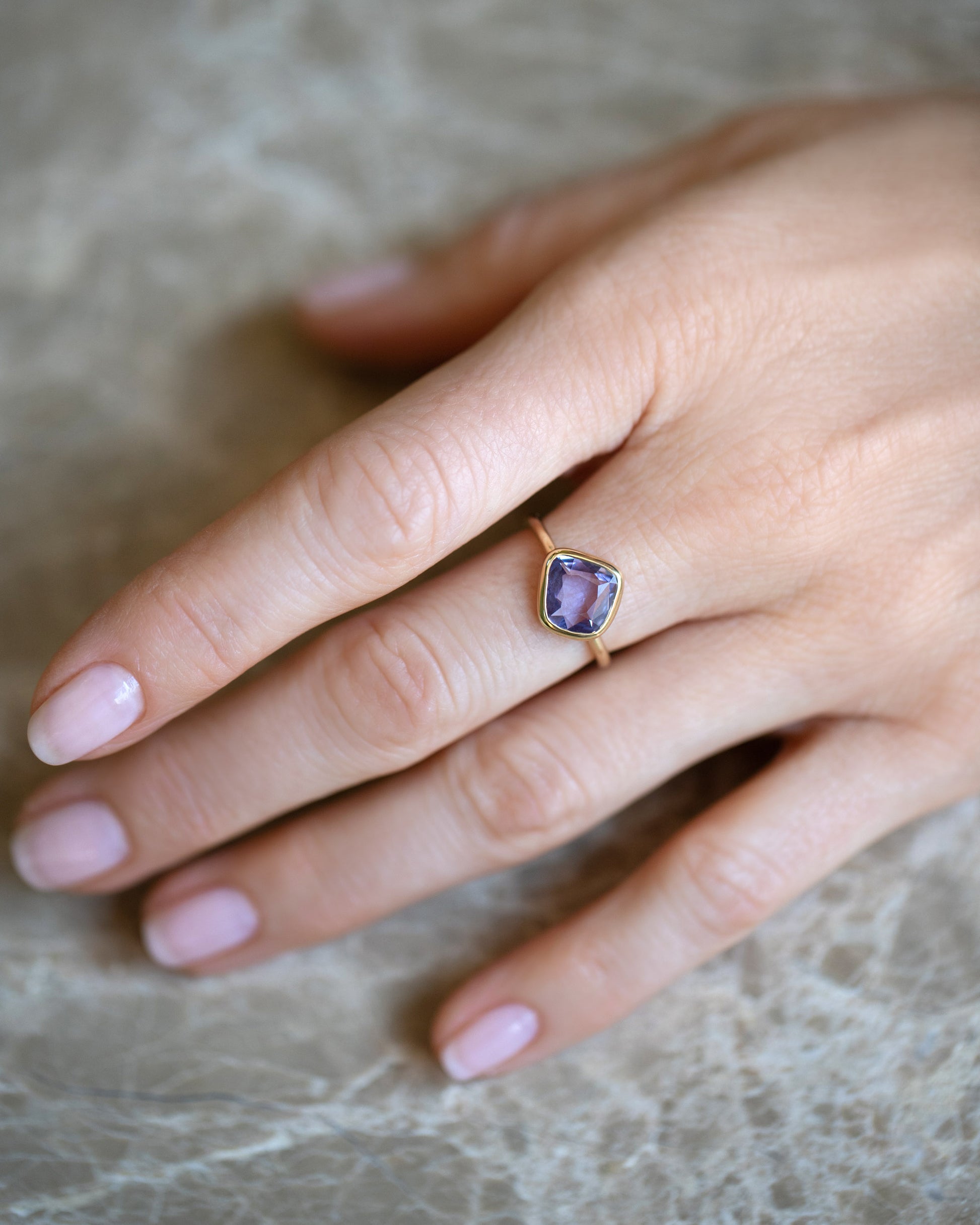 Gusher Purple Sapphire Ring 054 on model.