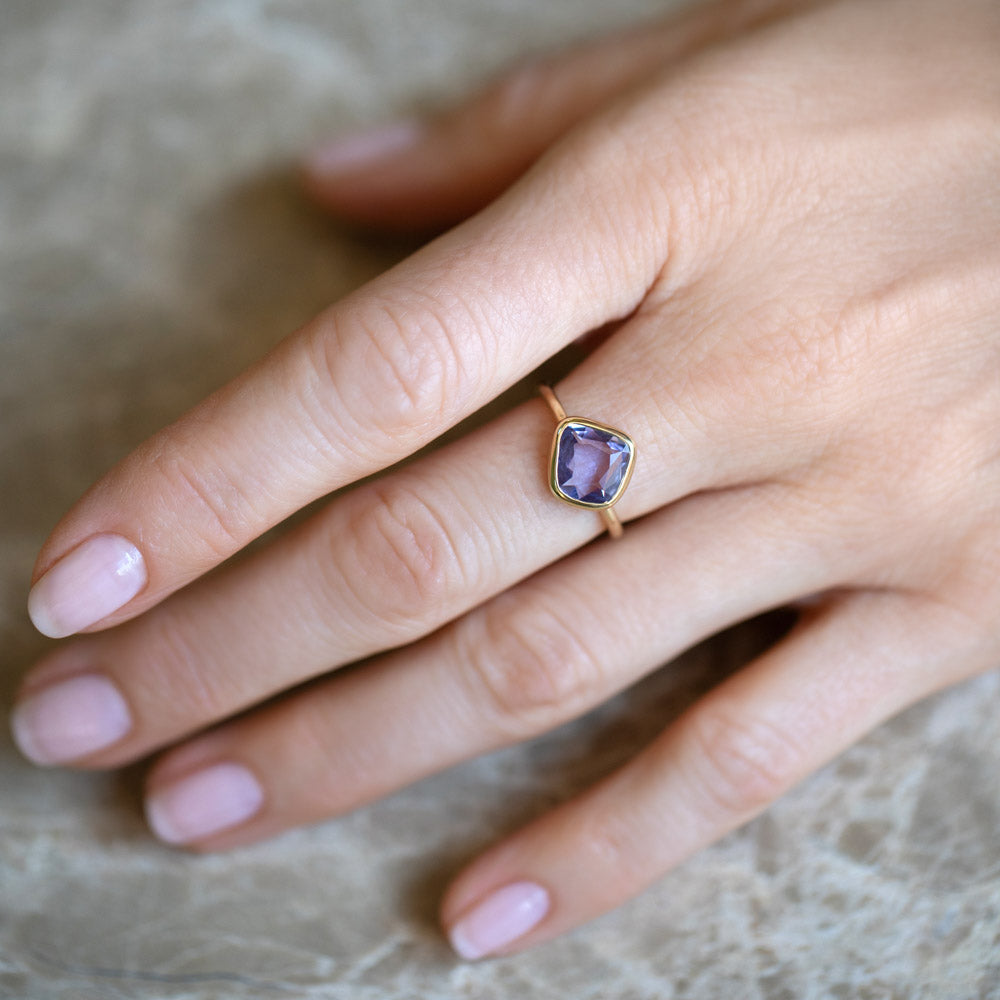 product_details::Gusher Purple Sapphire Ring 054 on model.