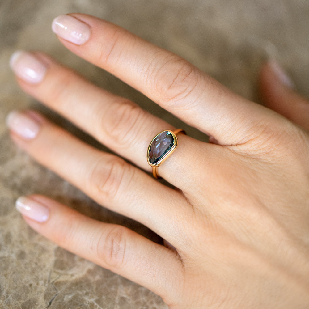 product_details::Gusher Teal Sapphire Ring 037 on model.