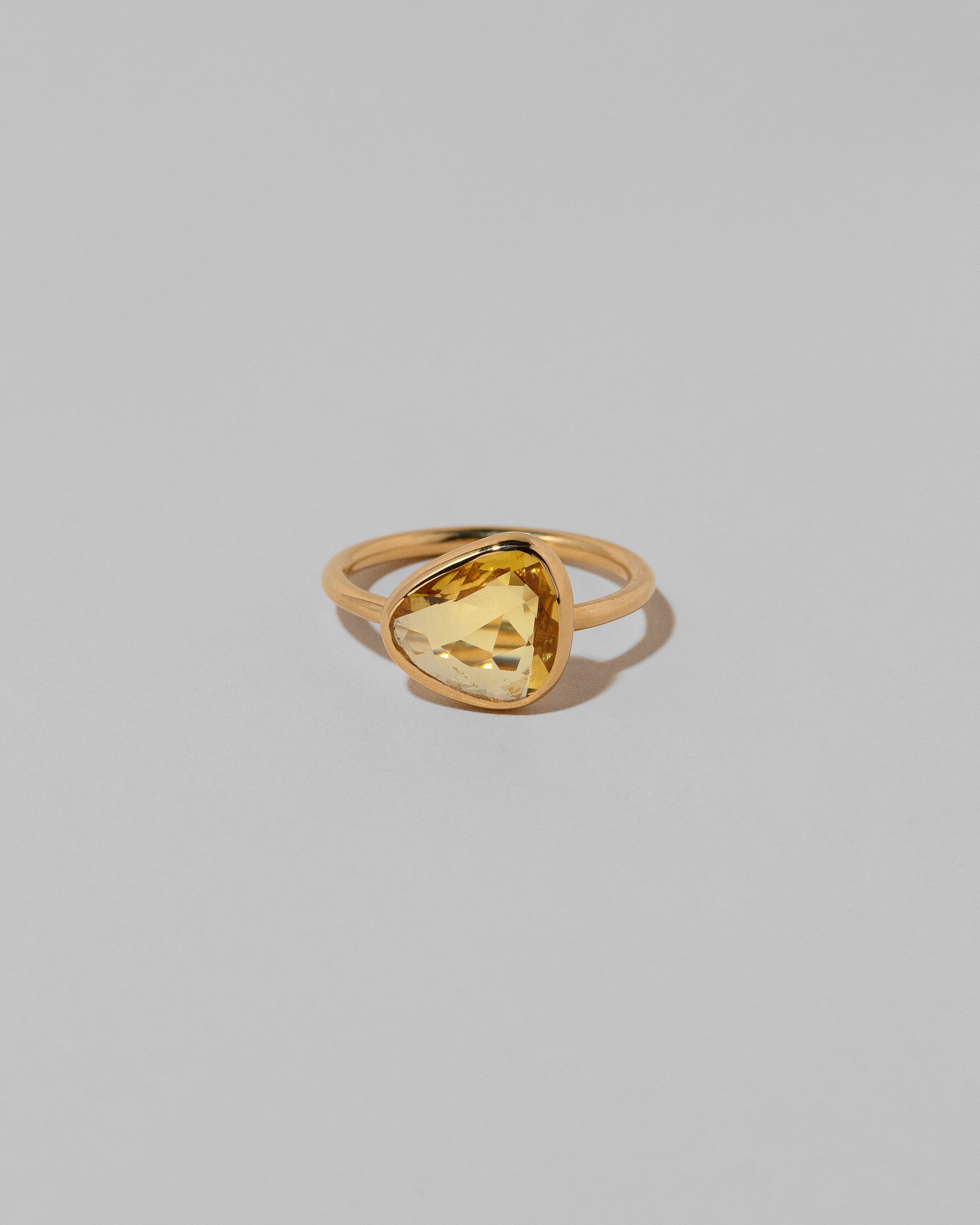 Gusher Yellow Sapphire Ring 035 on light color background.