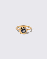 Bicolor Blue Sapphire Level Ring on light color background.