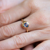product_details::Bicolor Blue Sapphire Level Ring on model.
