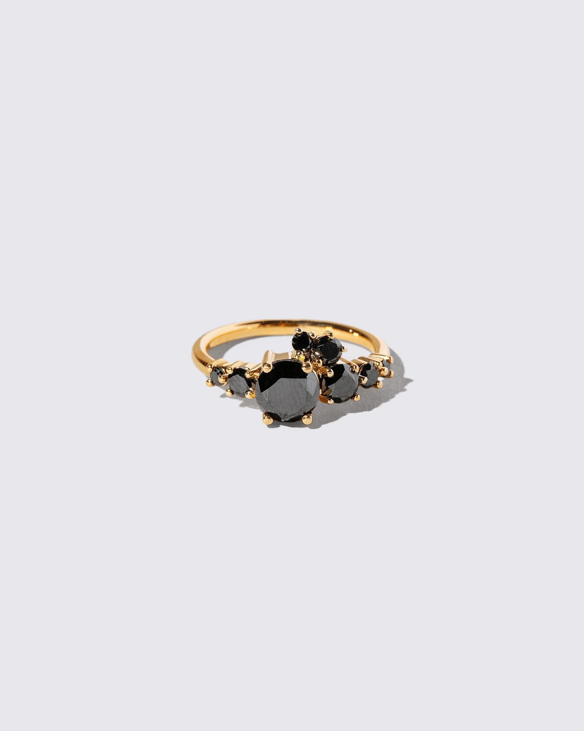 All Black Diamond Luna Ring on light color background.