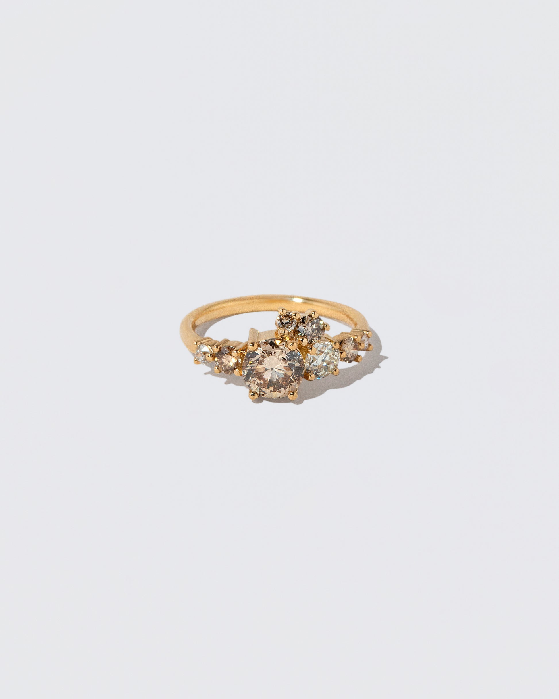 Champagne Diamond Luna Ring on light color background.