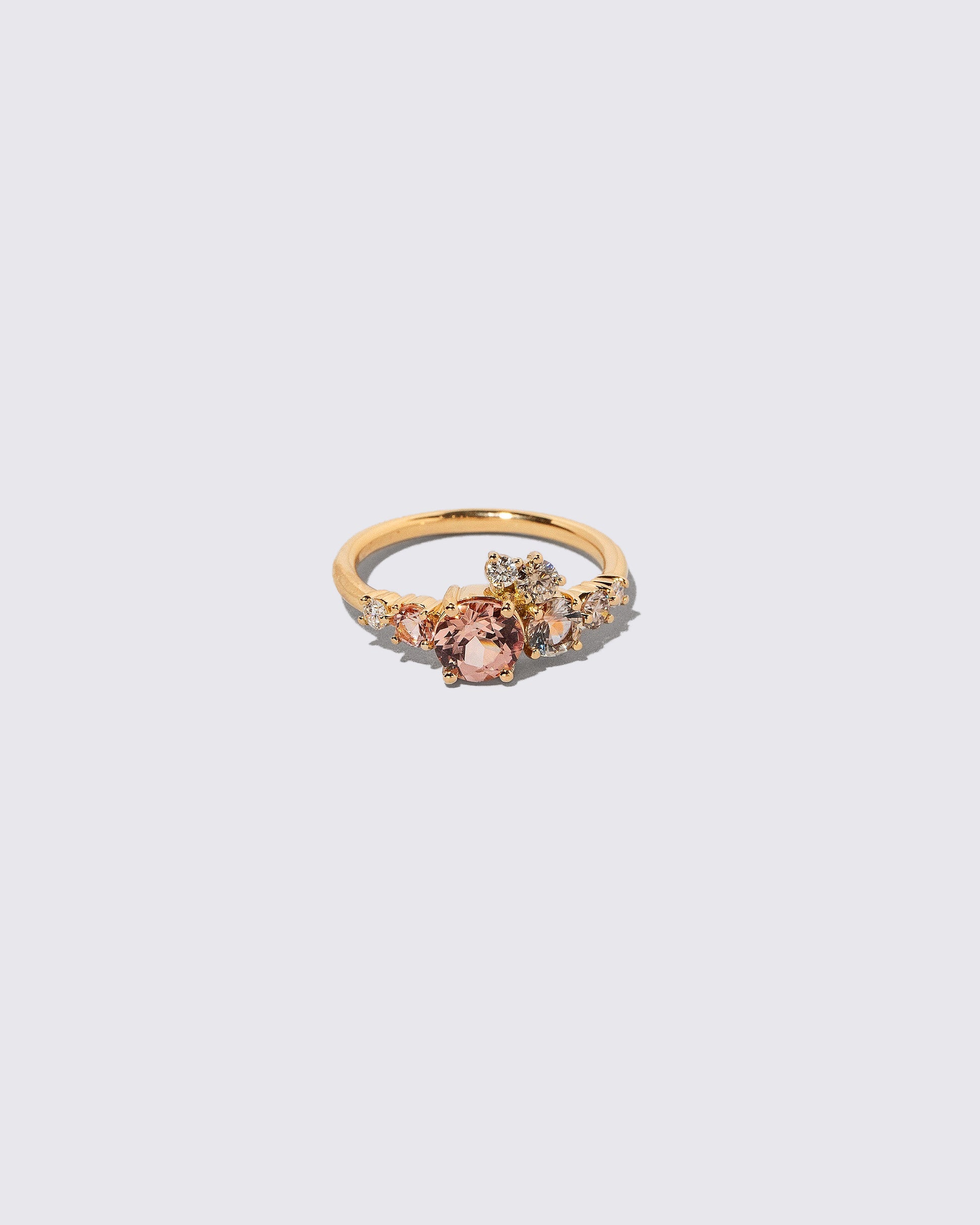 Lotus Garnet Luna Ring on light color background.