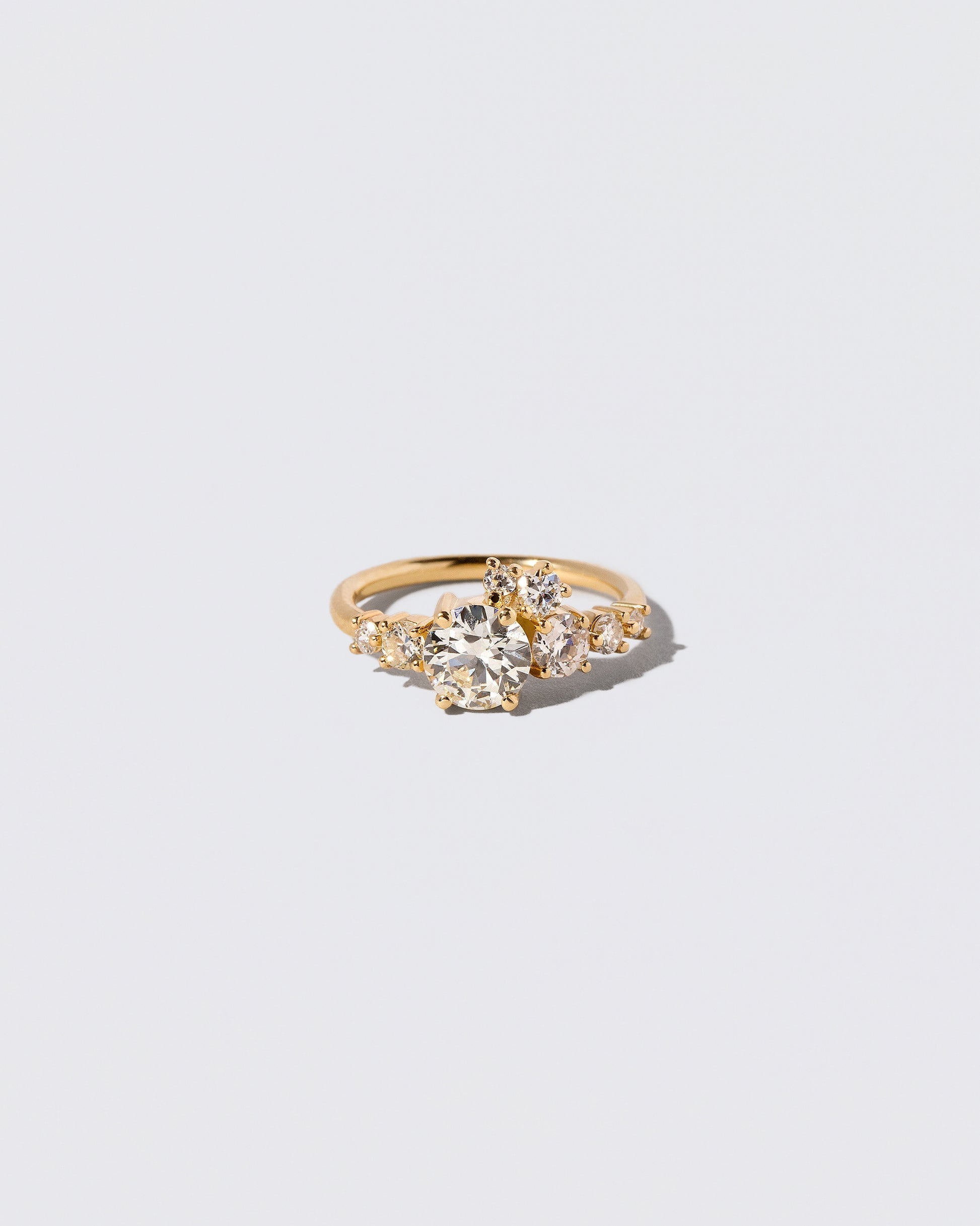 White Diamond Luna Ring on light color background.