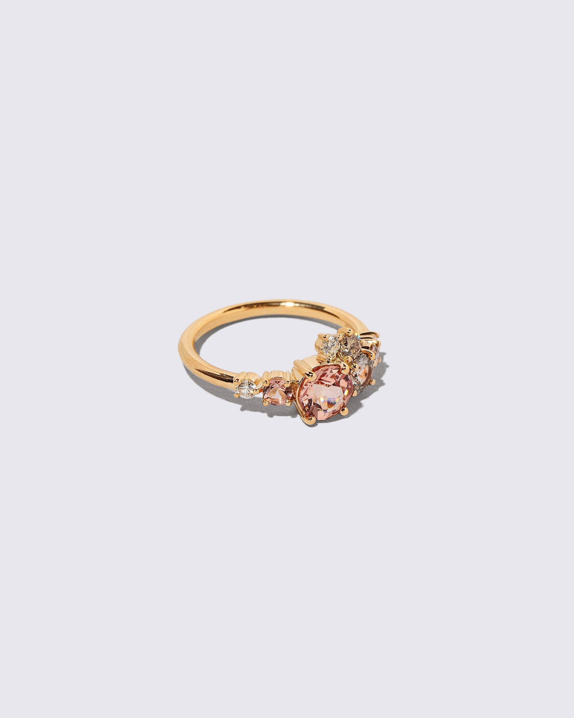 Closeup details of the Lotus Garnet Luna Ring on light color background.