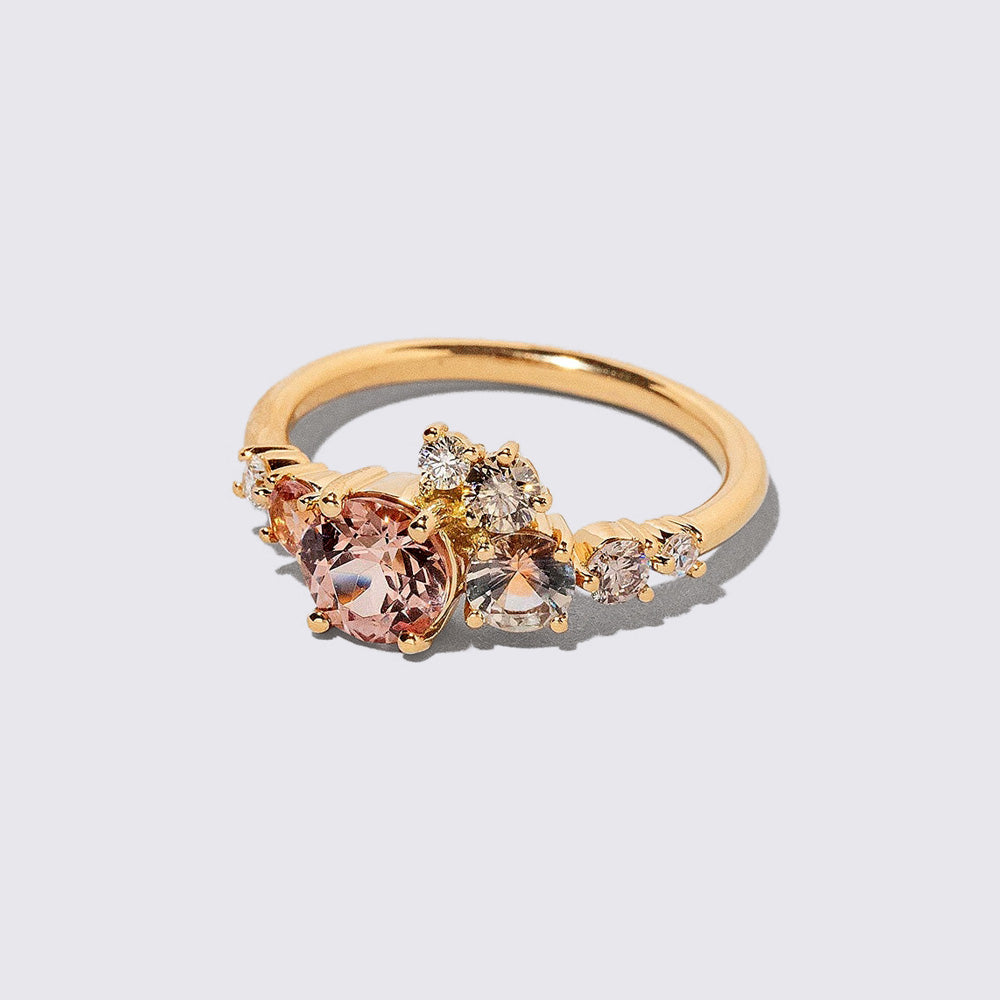 product_details::Closeup details of the Lotus Garnet Luna Ring on light color background.