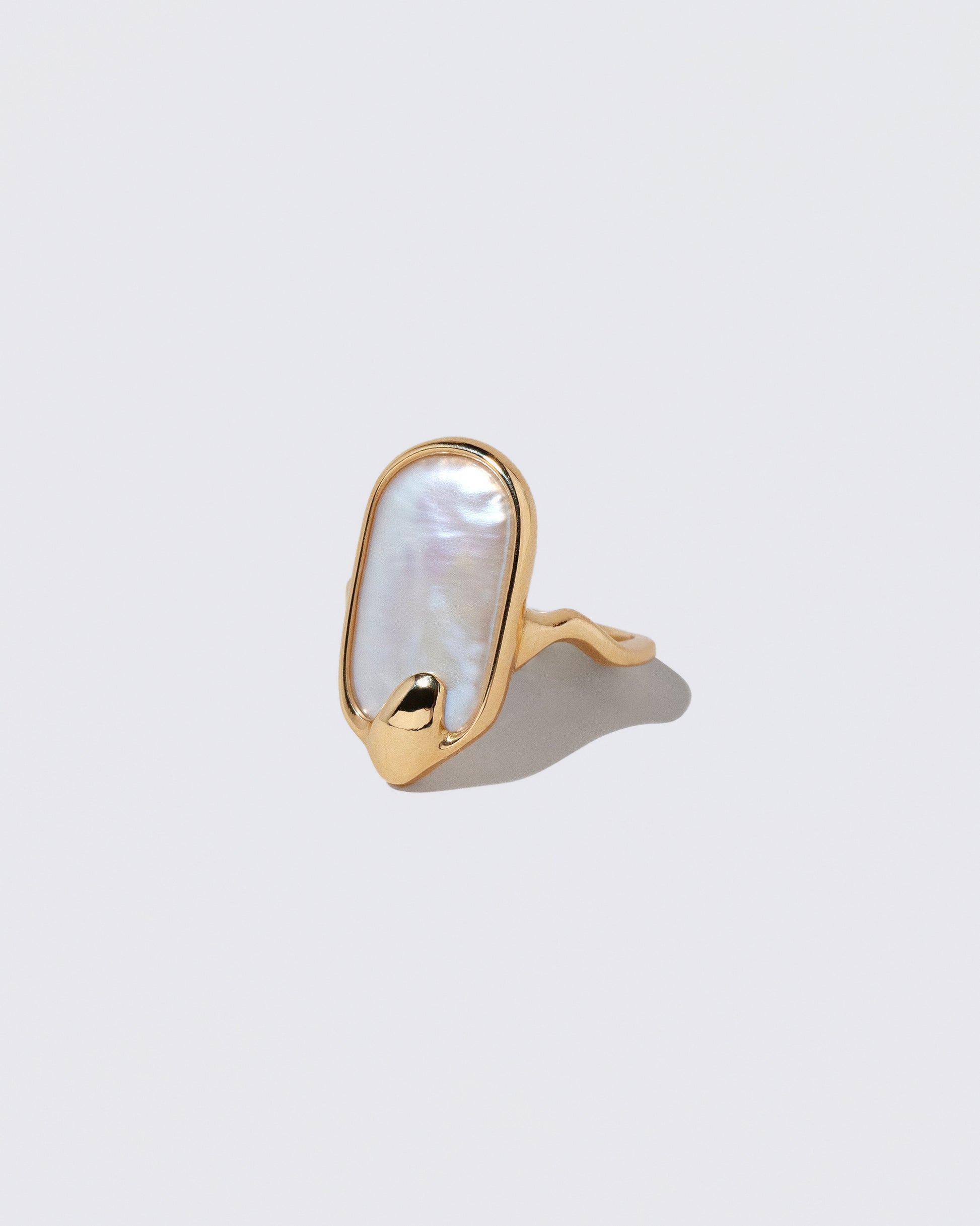 View from the side of the Oceanus Ring on light color background.