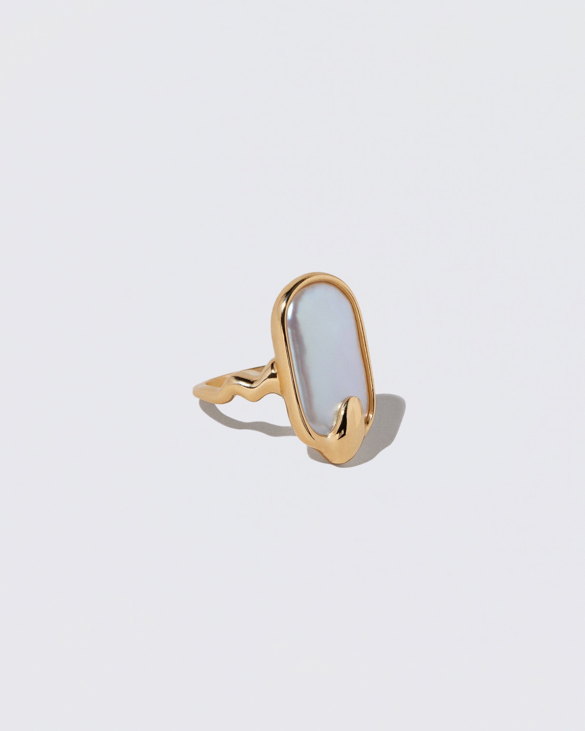 View from the side of the Oceanus Ring on light color background.