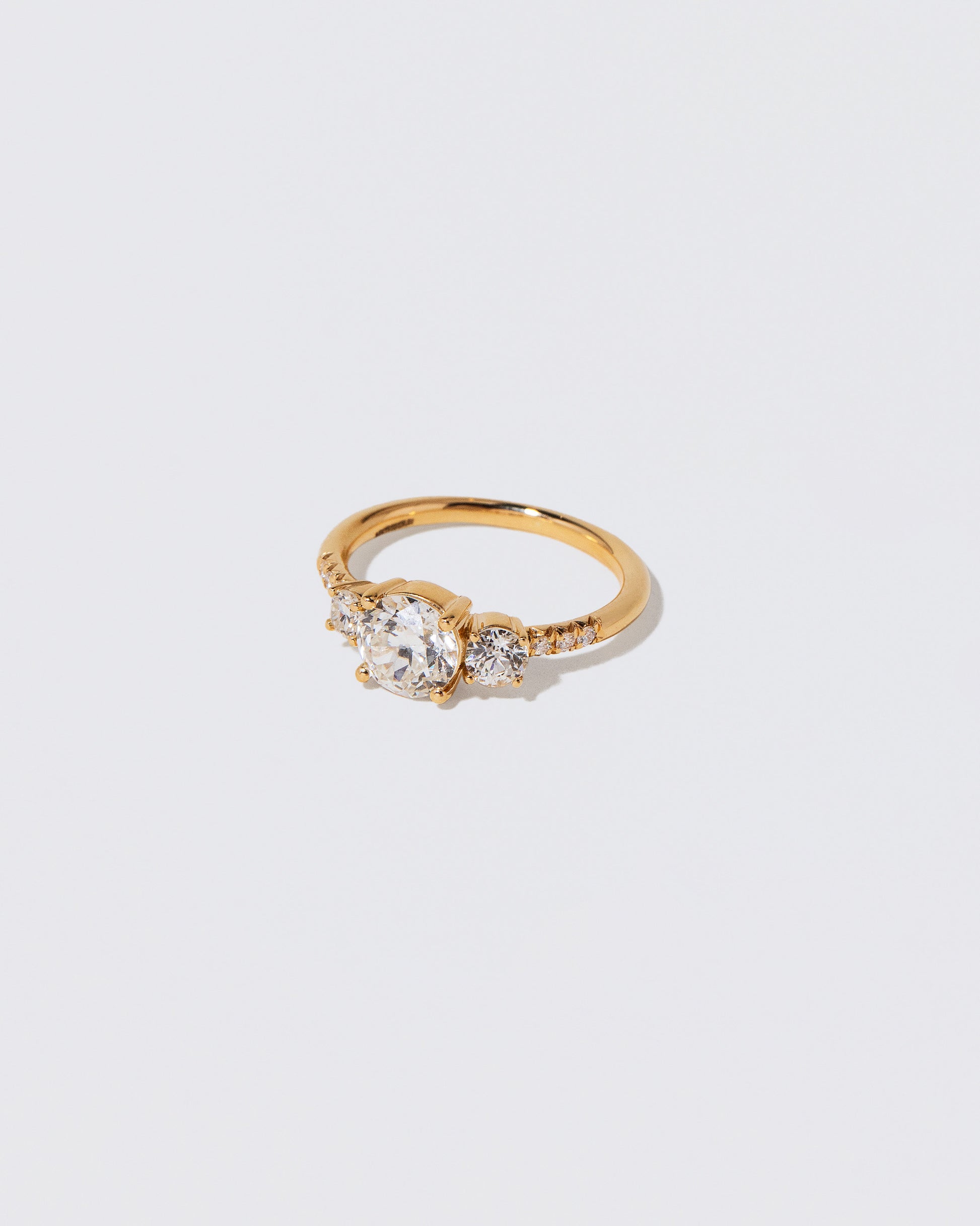 View from the side of the White Diamond Orion Ring on light color background.