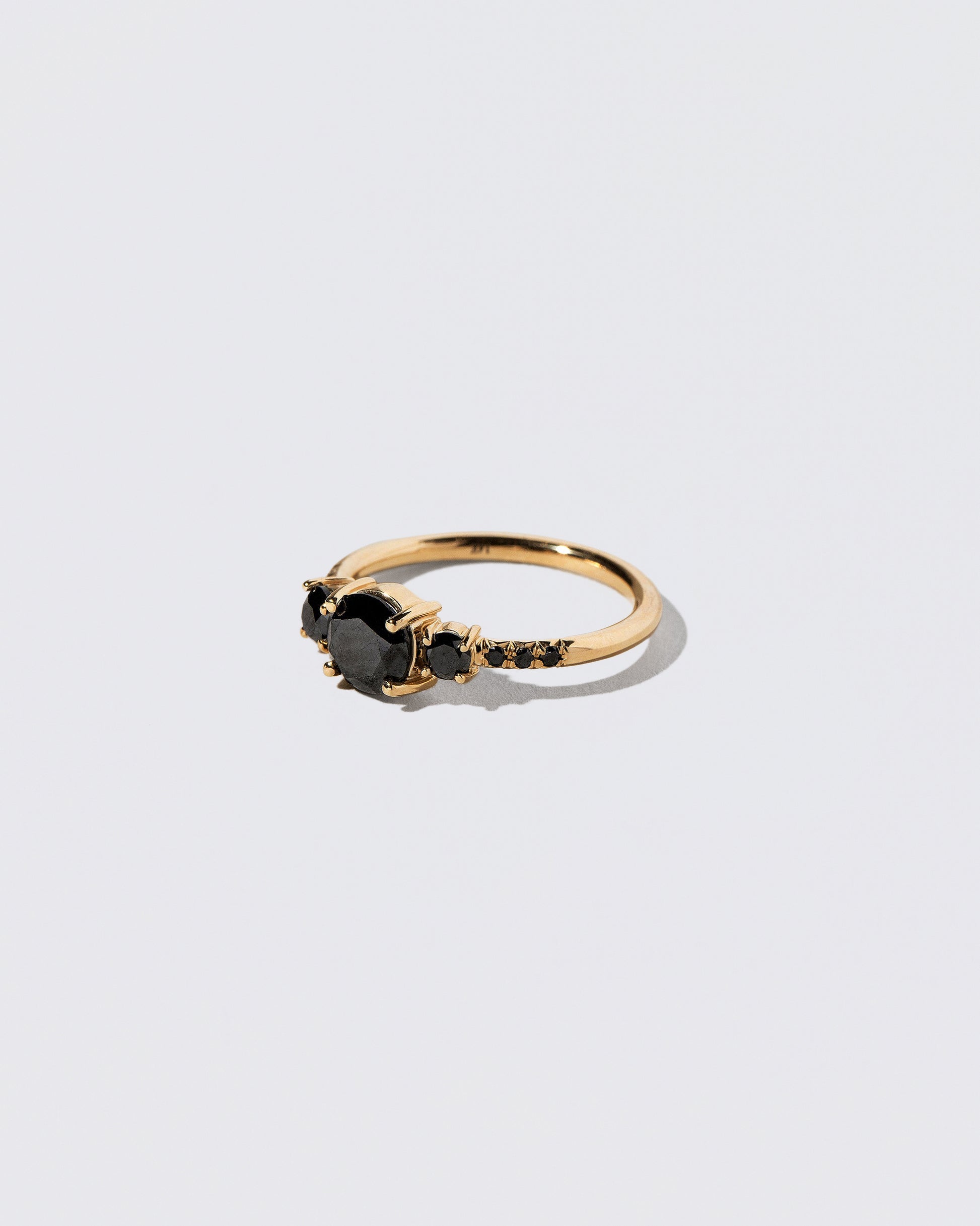 View from the side of the Black Diamond Orion Ring on light color background.