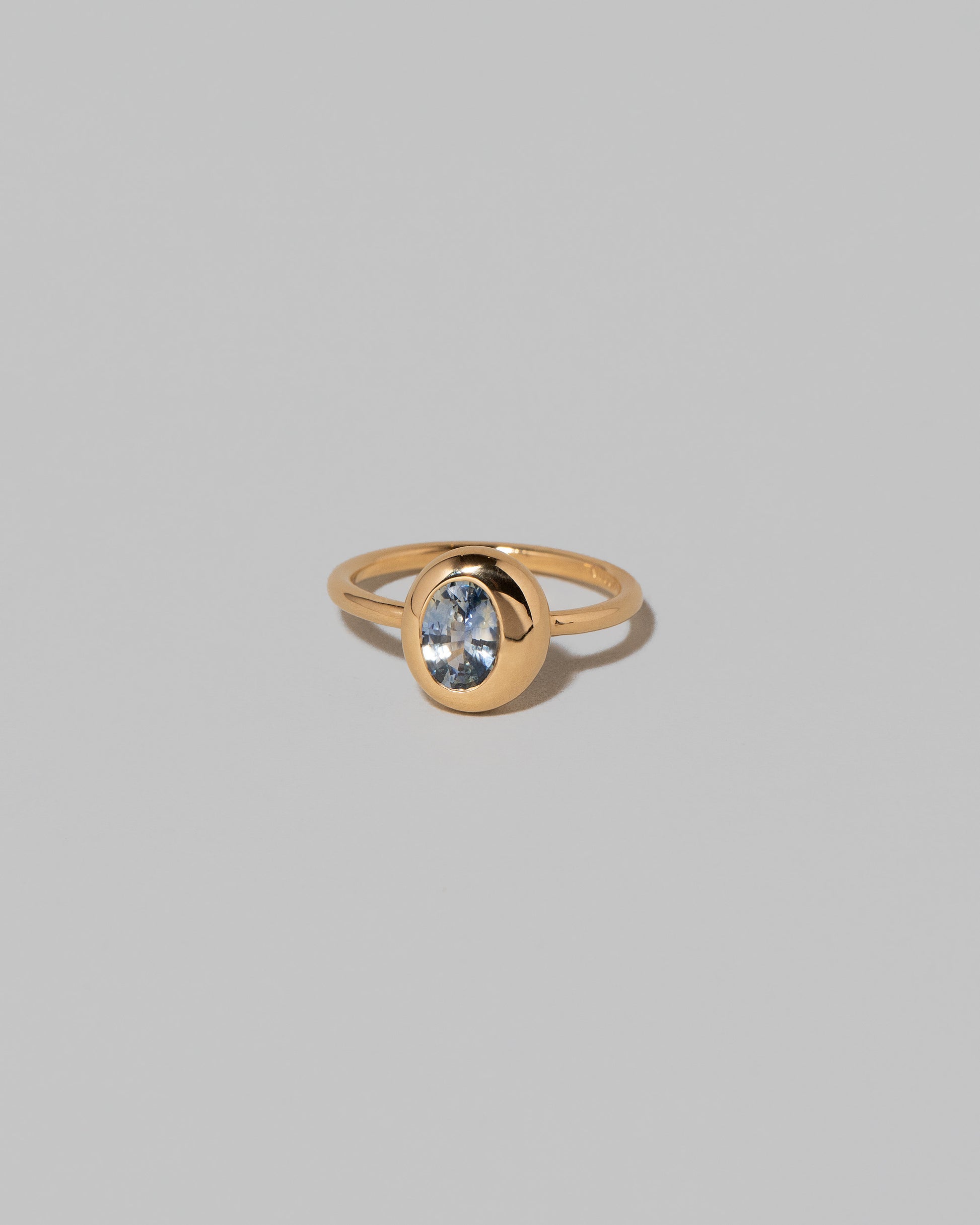 Oval Bicolor Sapphire Precise Ring on light color background.