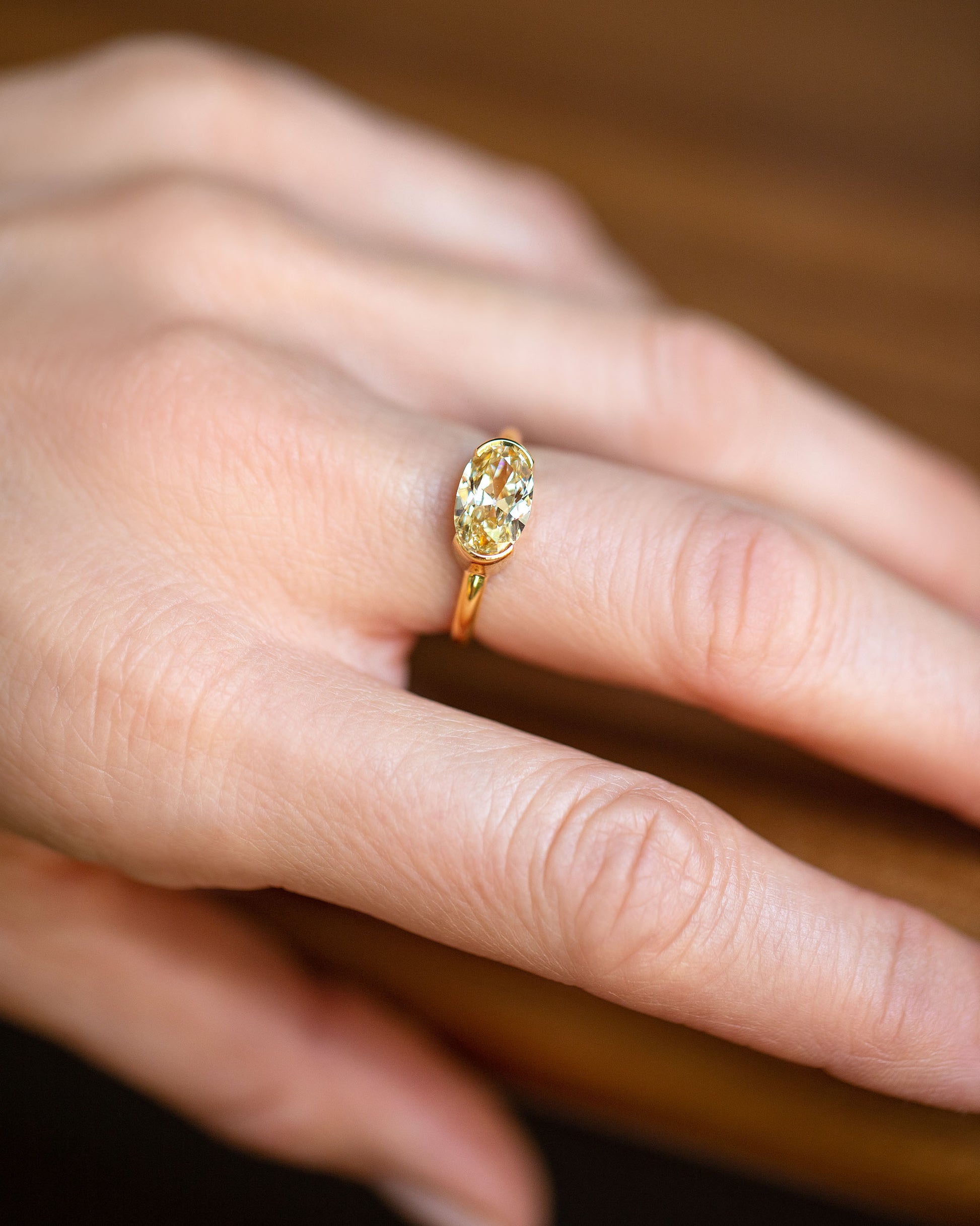 Oval Brown Diamond Transformation Ring on model.