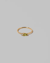 Peridot Teardrops Ring on light color background.