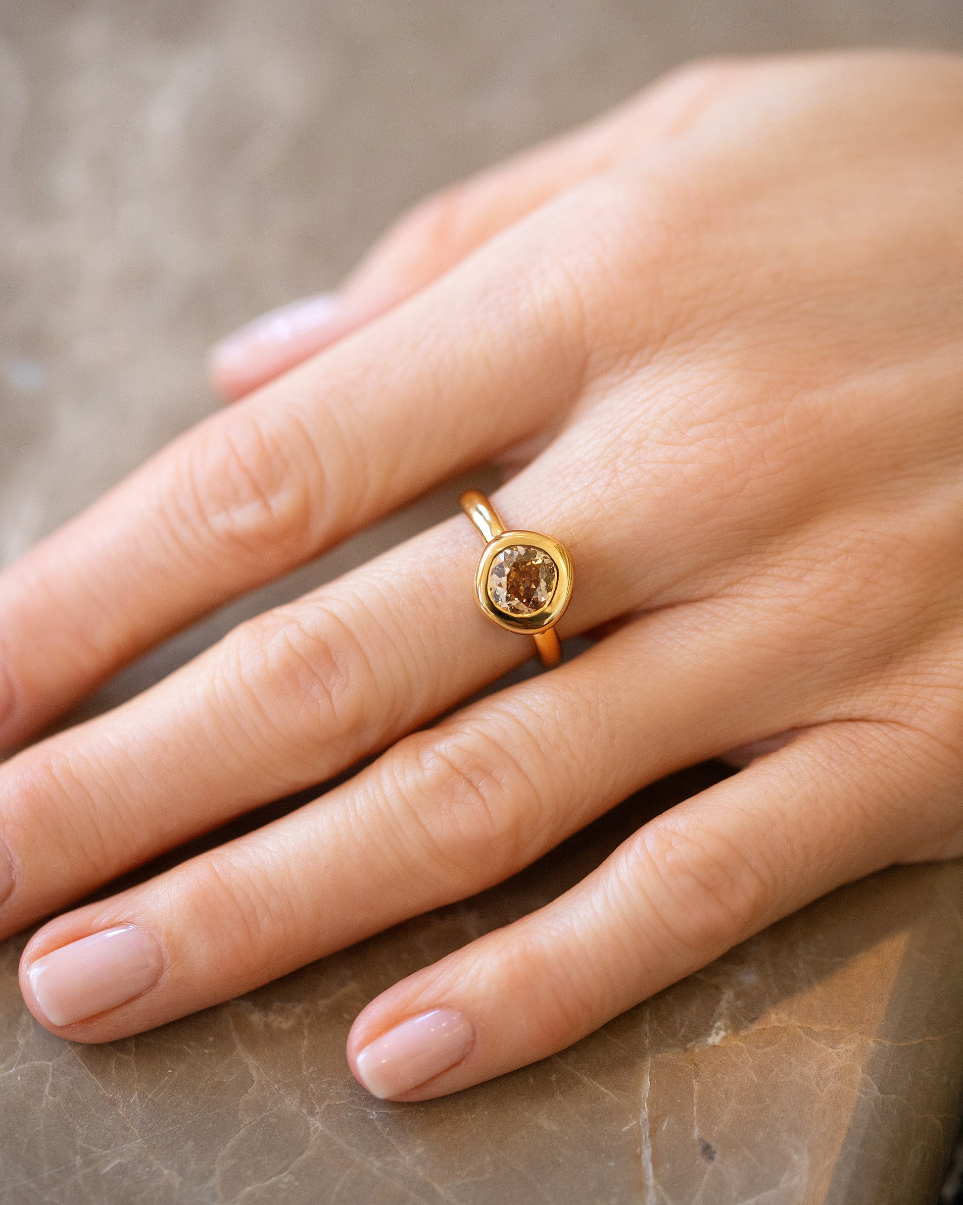 Brown Diamond Poise Ring on model.