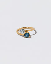 Sapphire & Diamond Sun & Moon Union Ring on light color background.