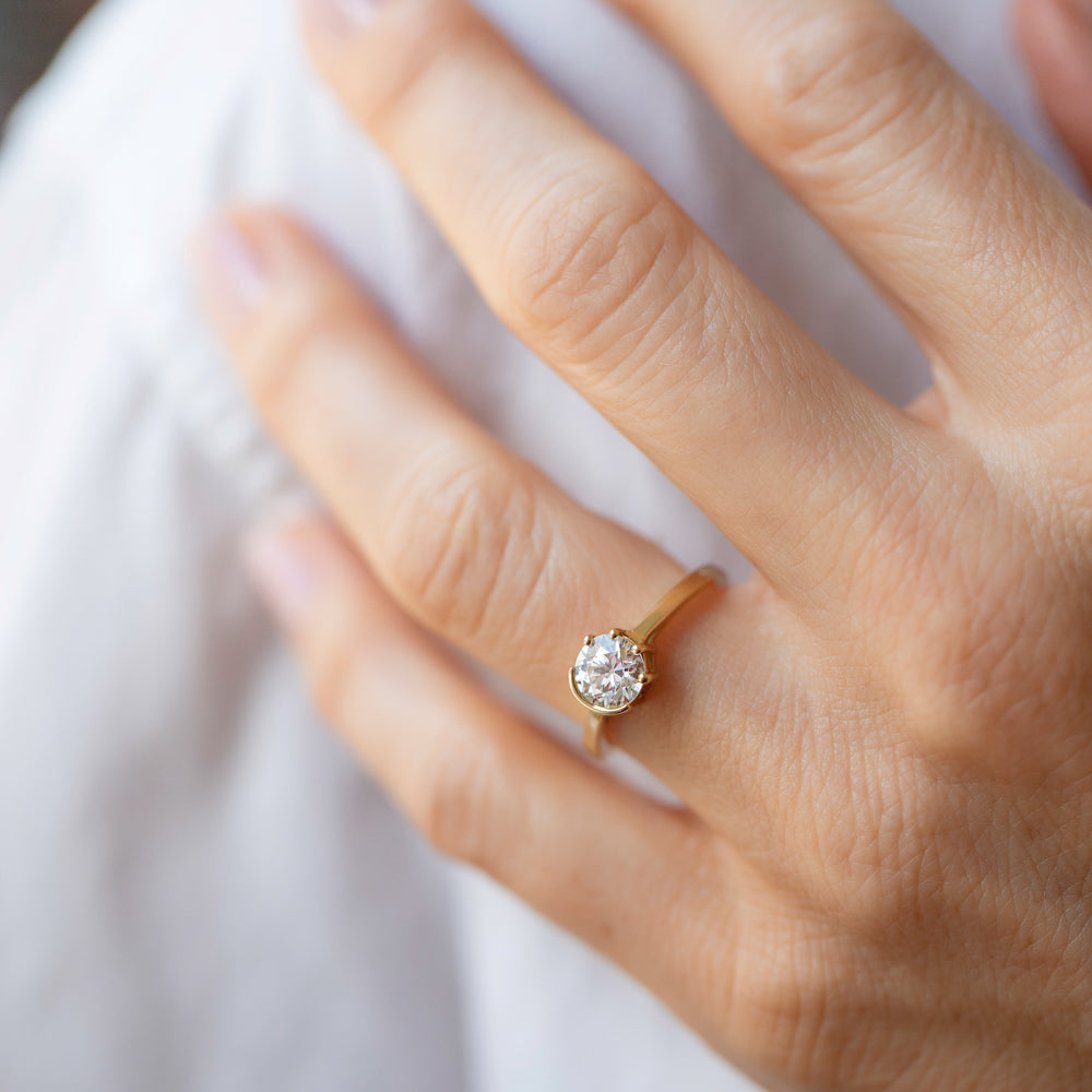 product_details::White Diamond Sun & Moon Ring on model.