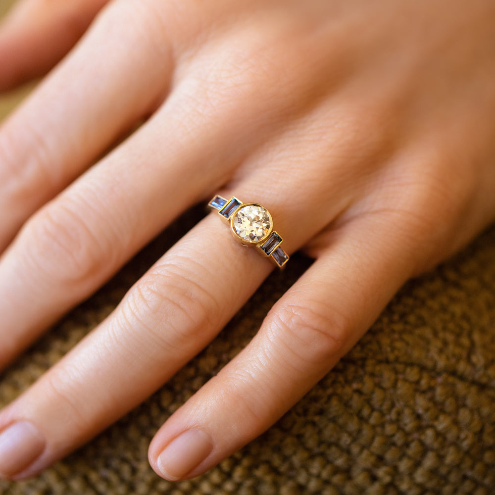 product_details::White Diamond & Blue Sapphire Third Eye Ring on model.