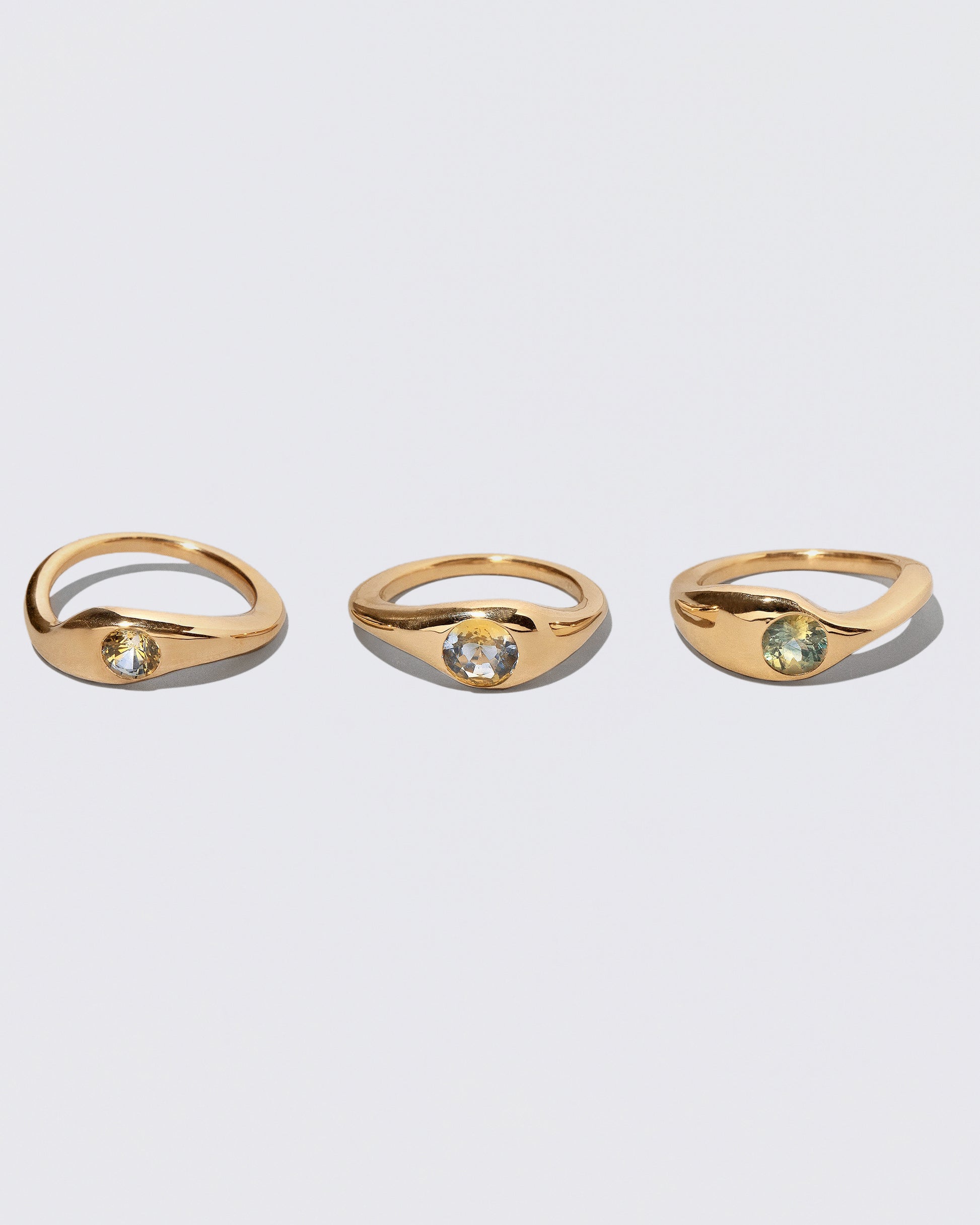 Detail view of the stacking elements making up the Three Ring on light color background.