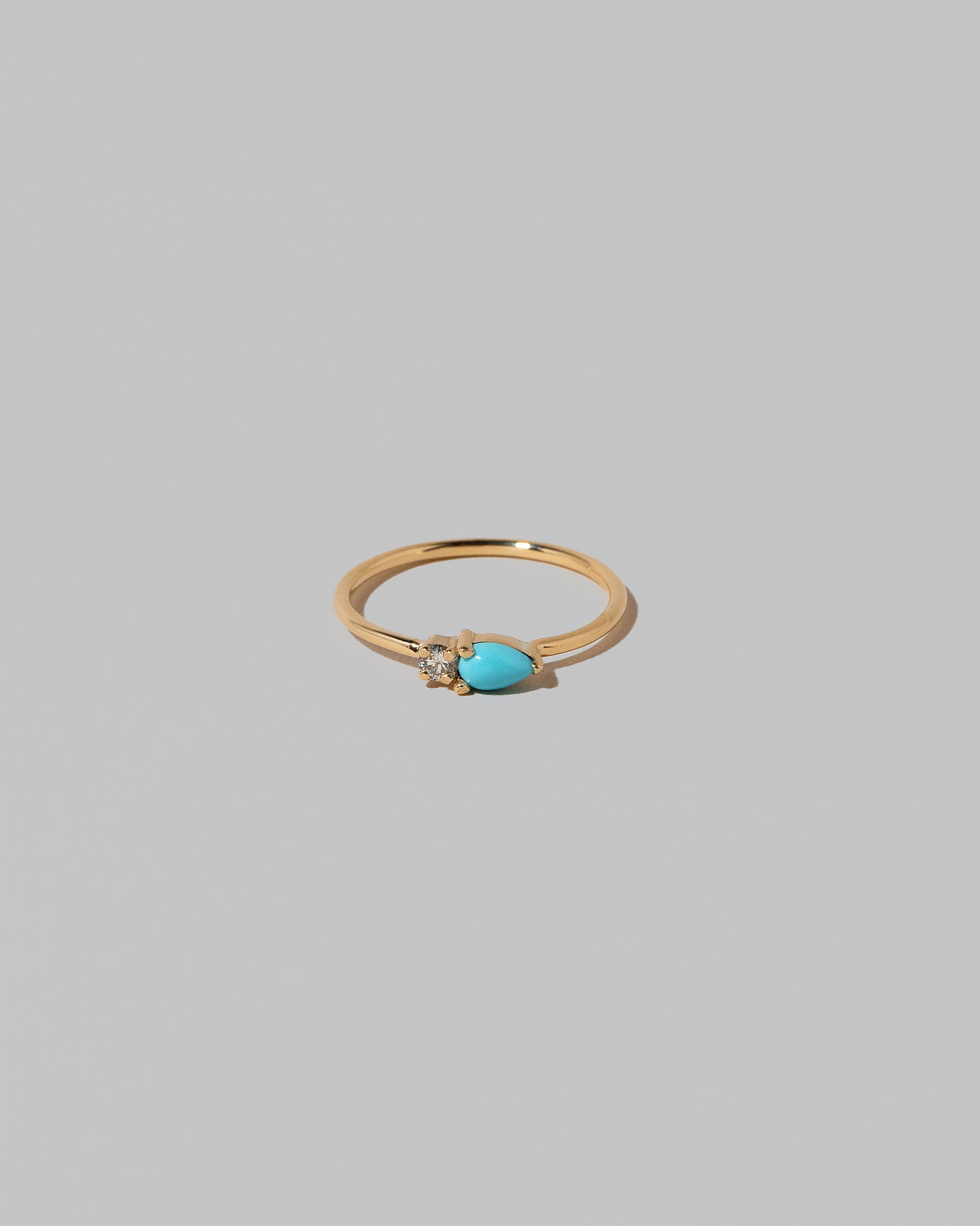 Turquoise Teardrops Ring on light color background.